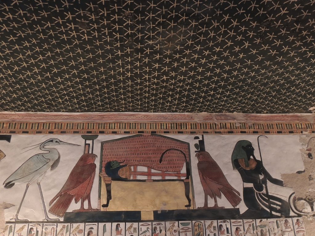 Sacred funerary bed guarded by protective gods beneath a star-covered ceiling in the tomb of Queen Nefertari, Valley of the Queens, Luxor Egypt
