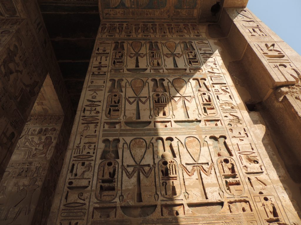 Hieroglyphic cartouches of Pharaoh Ramses II carved into temple stone at Karnak in Luxor, Egypt.