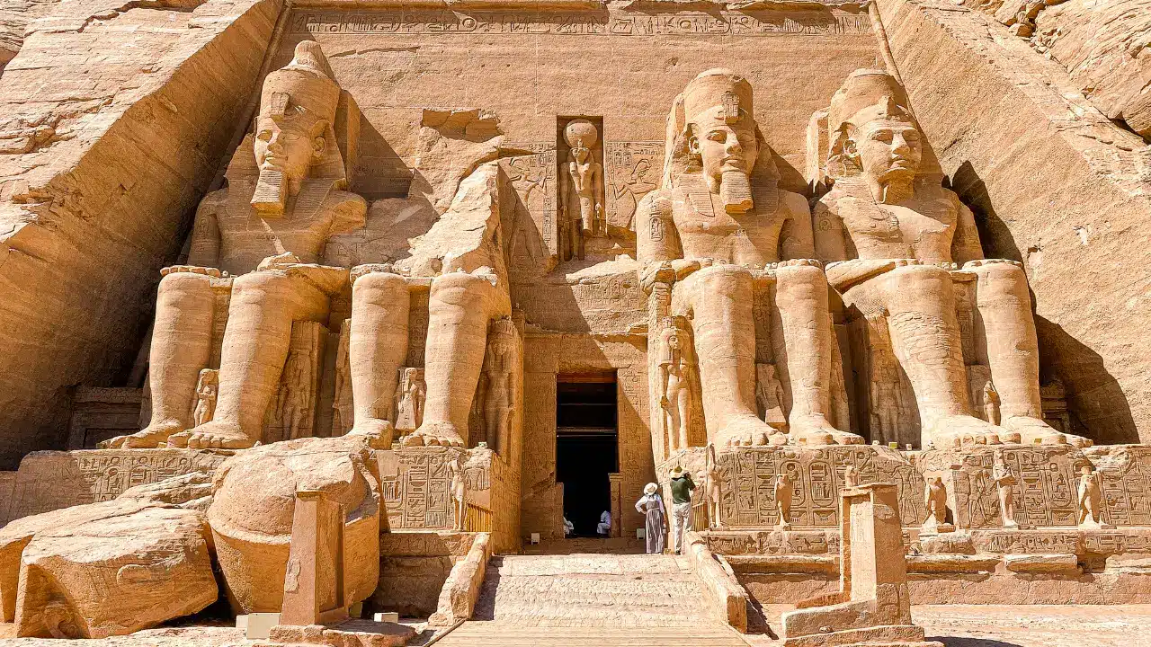 Facade of Abu Simbel temple with four colossal statues of Pharaoh Ramesses II in southern Egypt