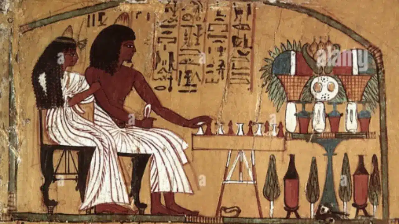 Ancient Egyptian tomb painting of a couple playing Senet board game with offering table and wine jars