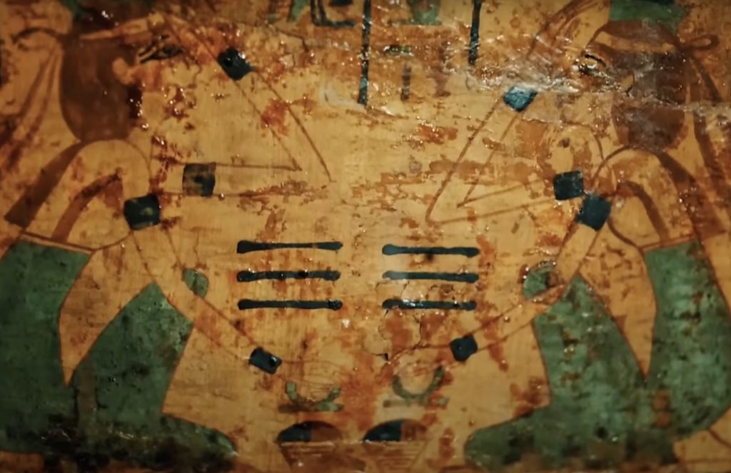 Ancient Egyptian painting showing two figures pouring liquid offerings, likely wine, in a ritual scene