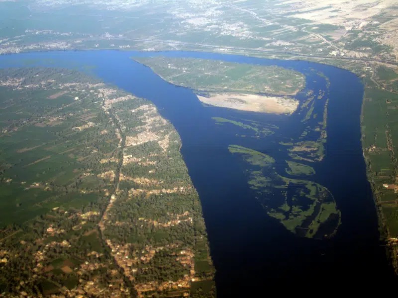 Aerial view of the Nile River flowing through the fertile Nile Valley surrounded by desert landscape in Egypt